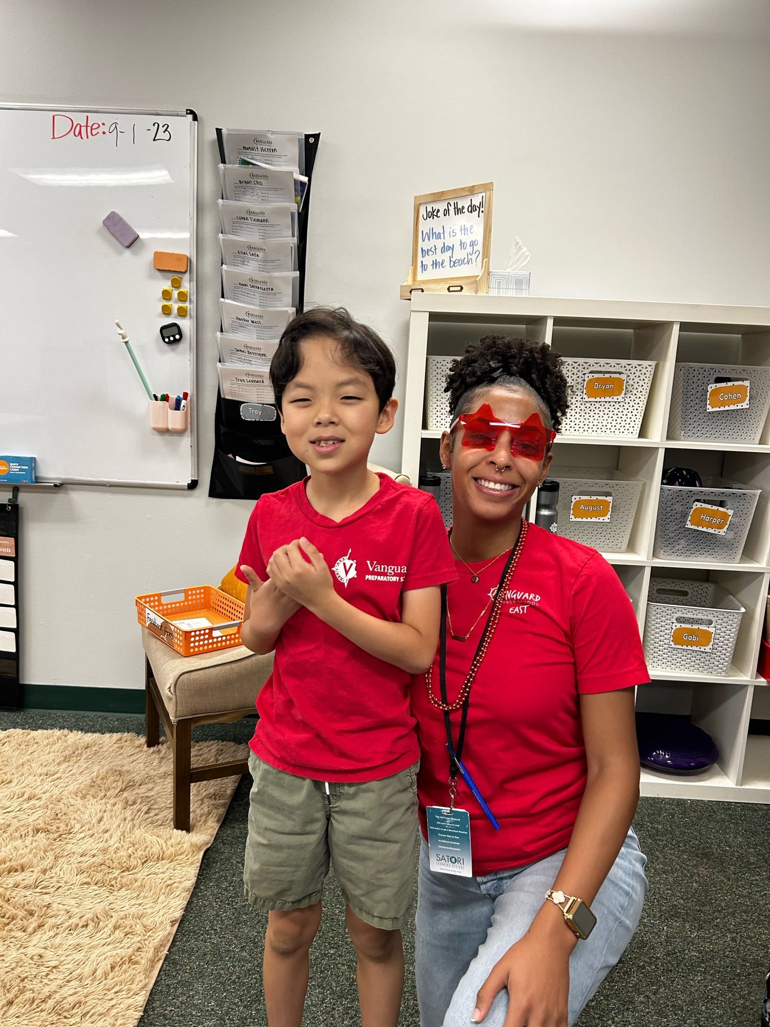 teacher and student smiling posing