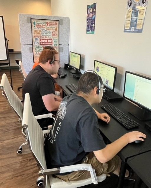 Teens working on computer