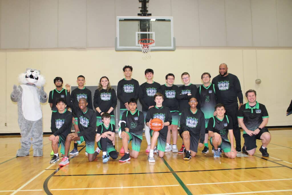 Vanguard basketball team photo with the mascot